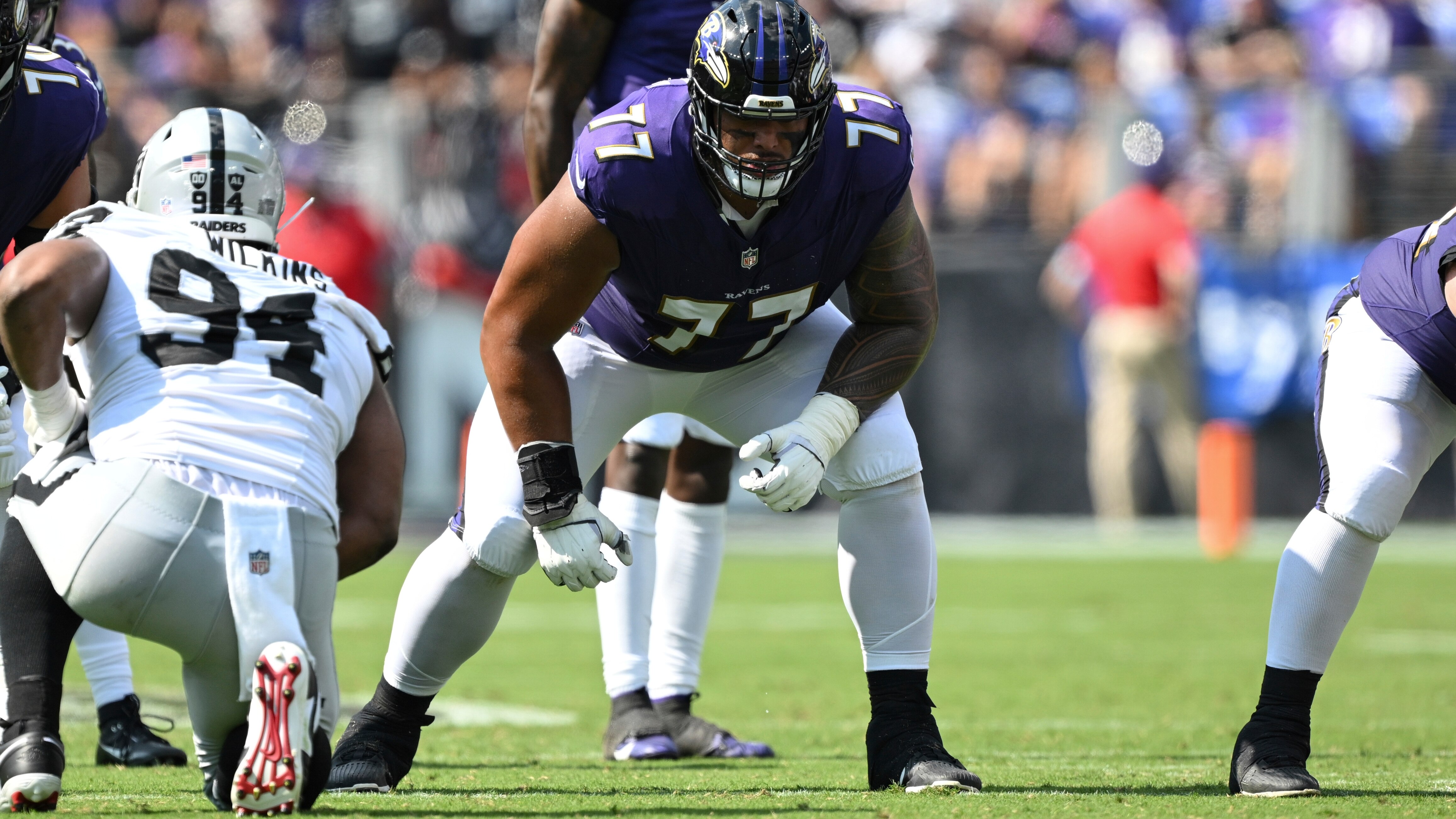 Baltimore Ravens offensive tackle Daniel Faalele (77) gets in position during the first half of an NFL football game against the Las Vegas Raiders, Sunday, Sep. 15, 2024, in Baltimore. (AP Photo/Terrance Williams)
