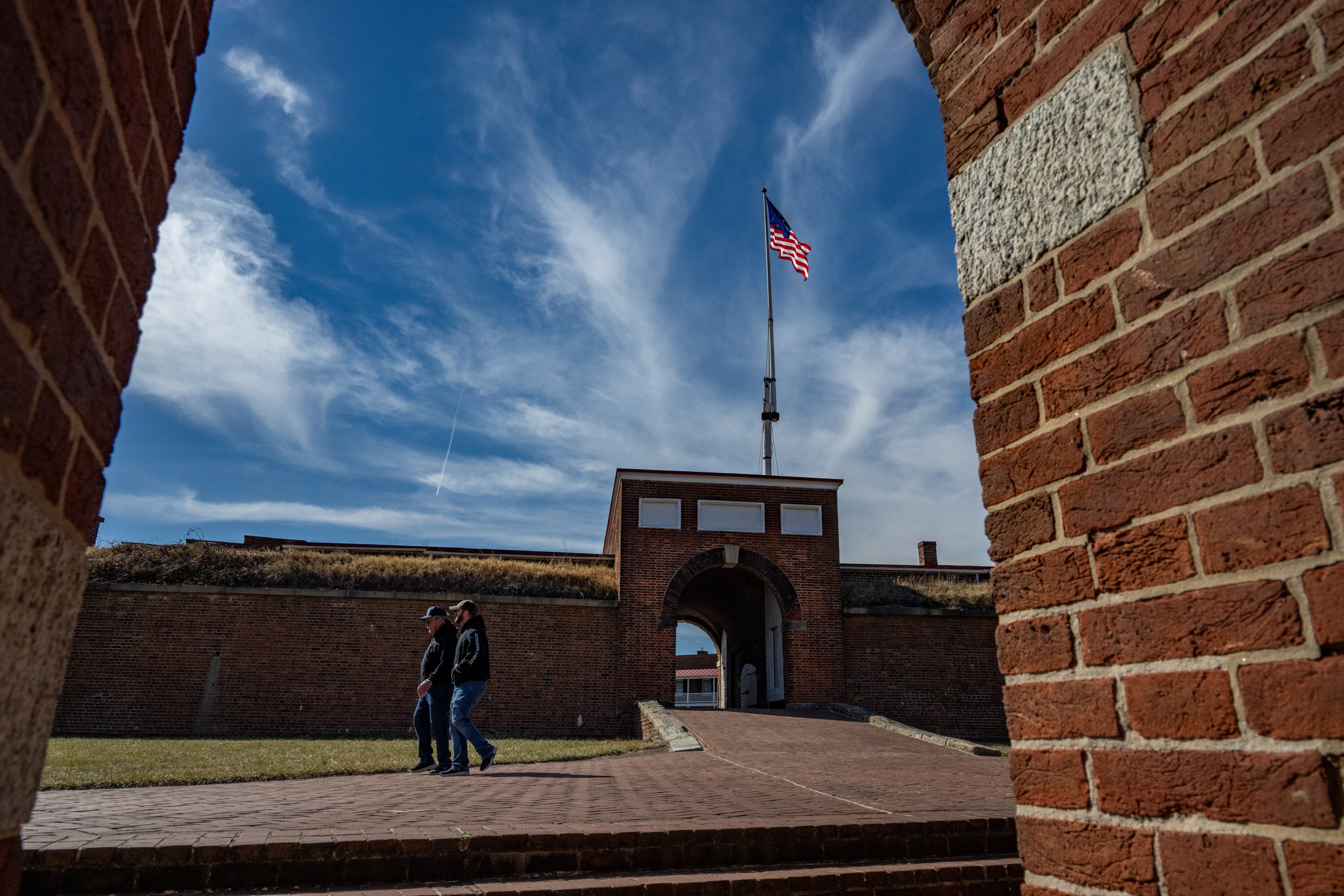 Visitors take in the Fort McHenry National Monument and Historic Shrine.