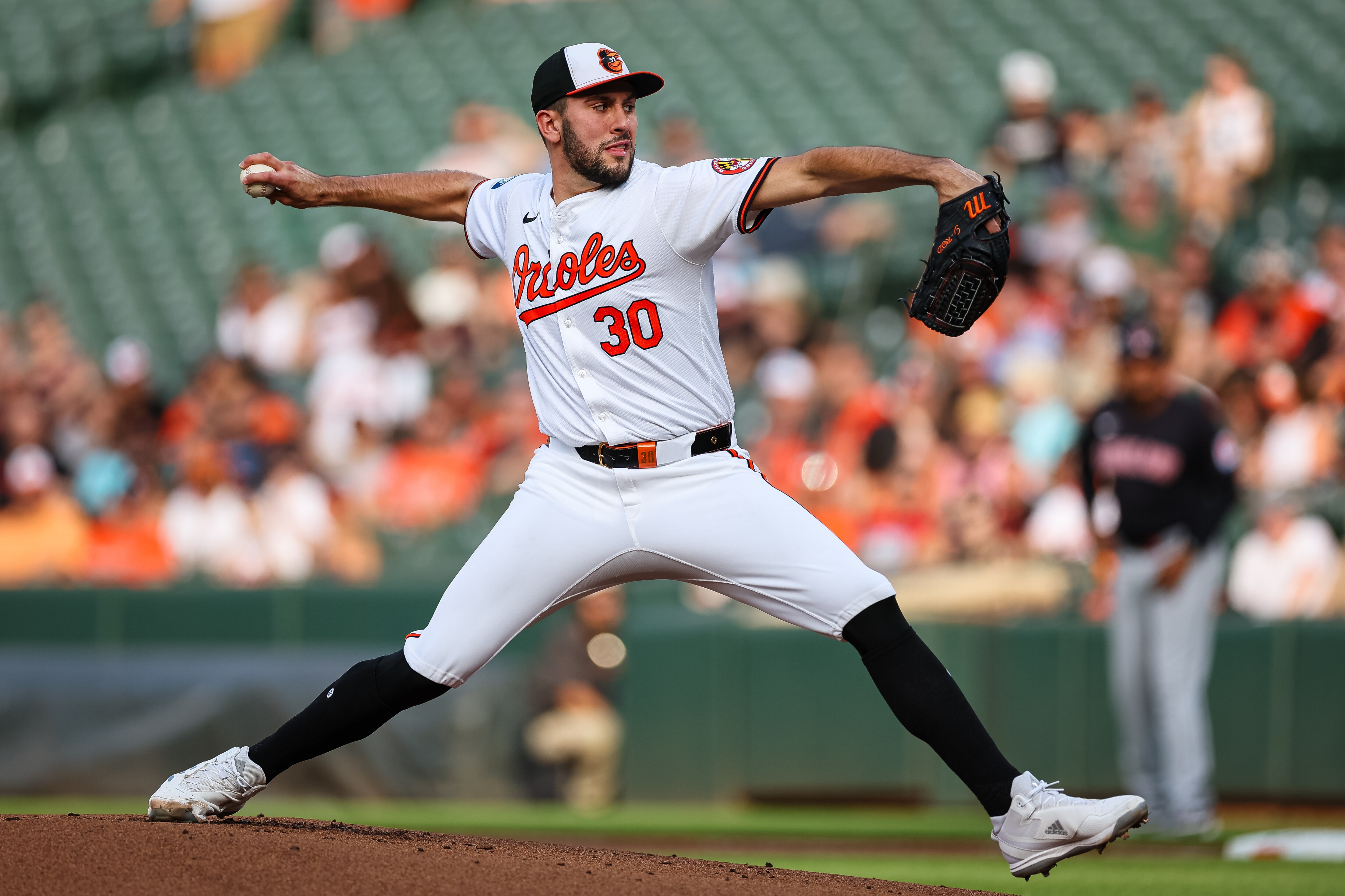 BALTIMORE, MD - JUNE 26: Grayson Rodriguez #30 of the Baltimore Orioles pitches against the Cleveland Guardians in the first inning at Oriole Park at Camden Yards on June 26, 2024 in Baltimore, Maryland. (Photo by Scott Taetsch/Getty Images)