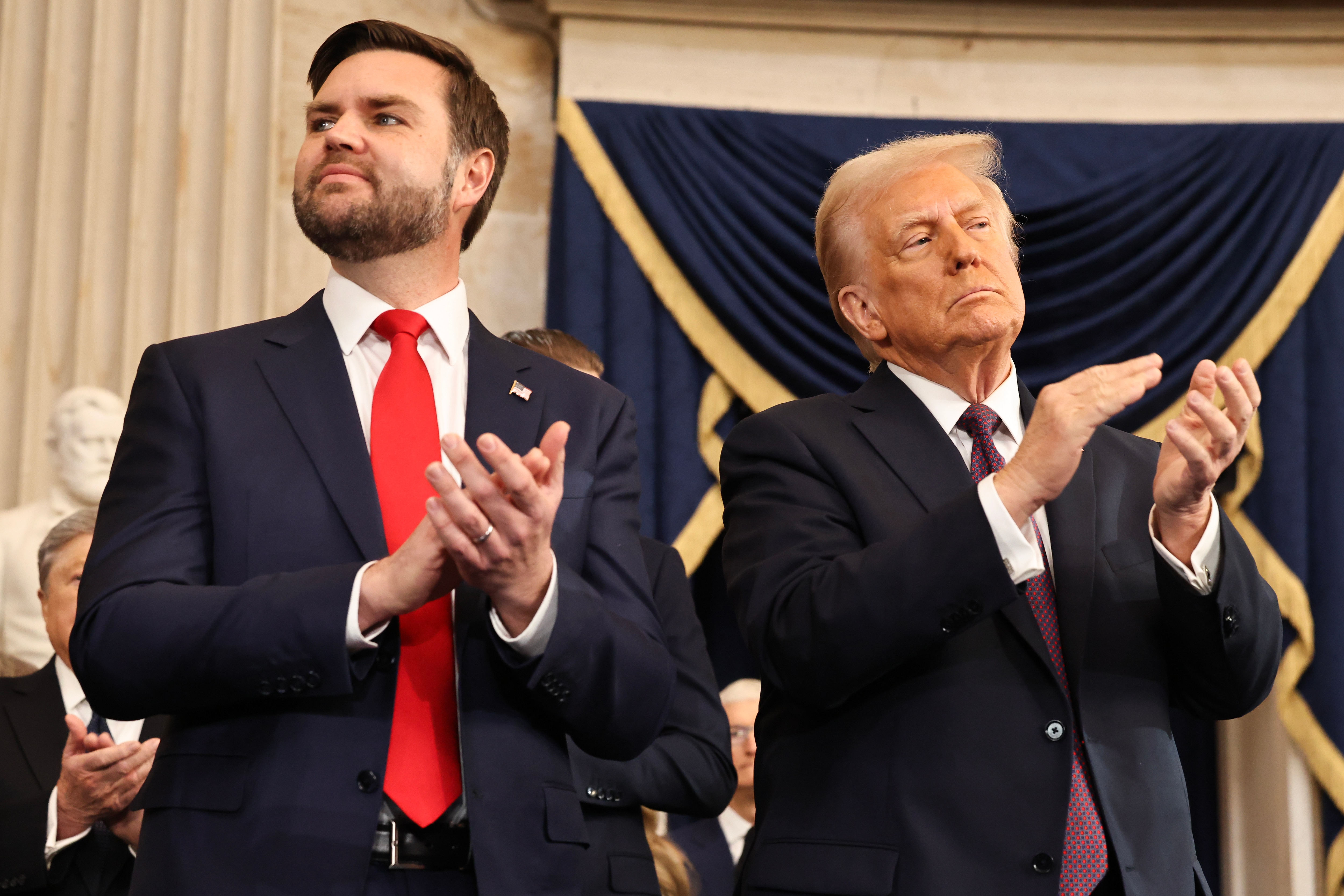 WASHINGTON, DC - JANUARY 20: U.S. Vice President J.D. Vance and U.S. President Donald Trump react during inauguration ceremonies in the Rotunda of the U.S. Capitol on January 20, 2025 in Washington, DC. Donald Trump takes office for his second term as the 47th president of the United States.