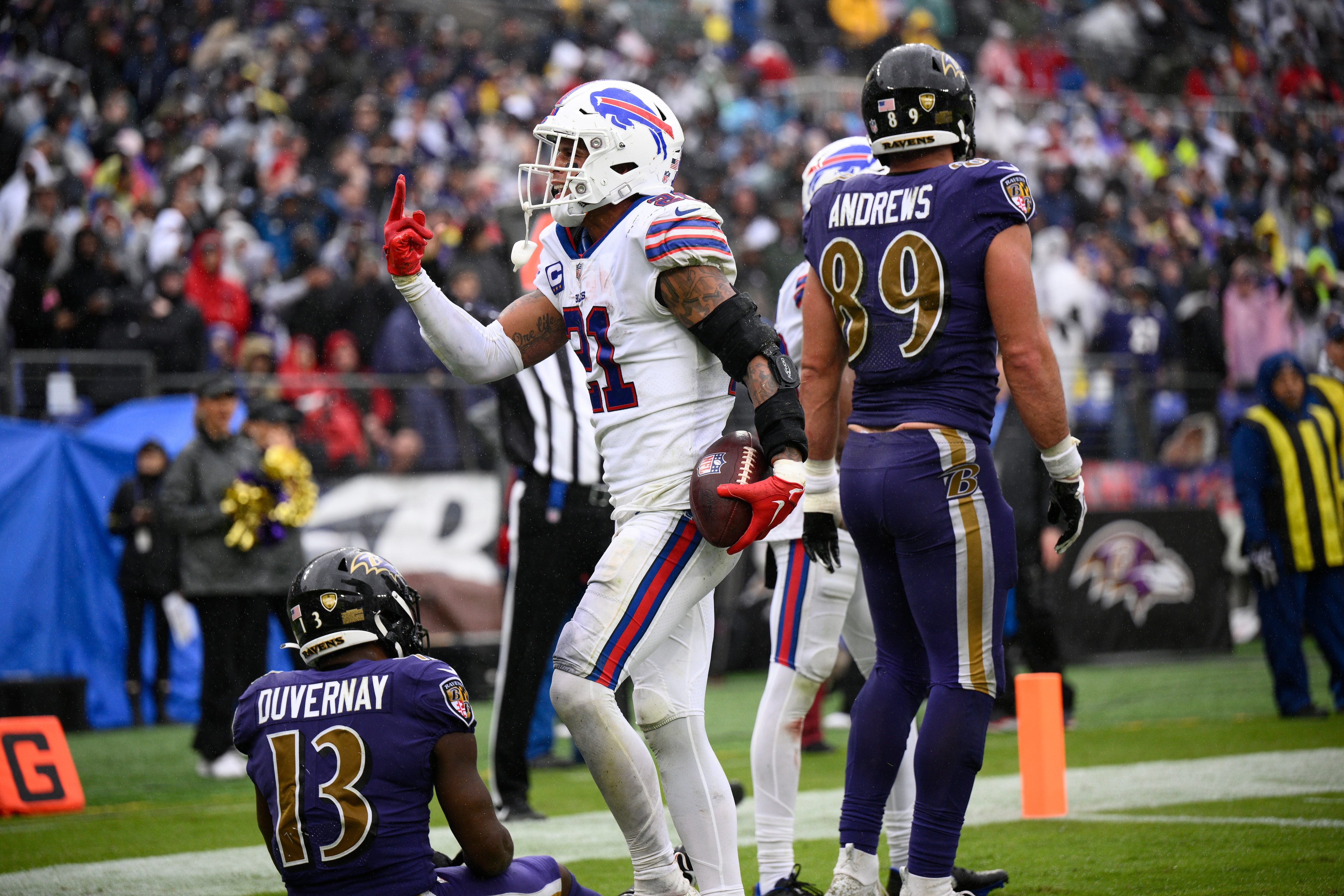 Buffalo Bills safety Jordan Poyer (21) celebrates after making an interception in the end zone on a pass intended for Baltimore Ravens wide receiver Devin Duvernay (13) in the second half of an NFL football game Sunday, Oct. 2, 2022, in Baltimore.