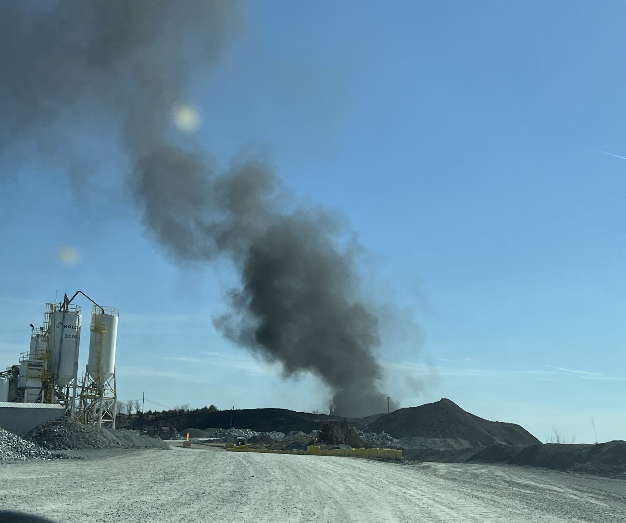 Several oil tanks caught on fire late Thursday morning at a quarry in the Maryland suburbs of Washington, D.C., sending thick plumes of black smoke into the air that were visible for miles.