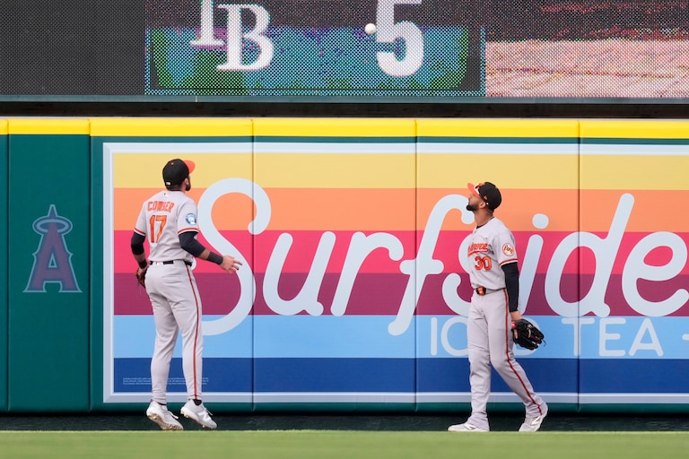 Orioles center fielder Colton Cowser, left, and right fielder Leody Taveras watch as a ball hit by Los Angeles Angels' Nolan Schanuel goes out for a two-run home run during the first inning.