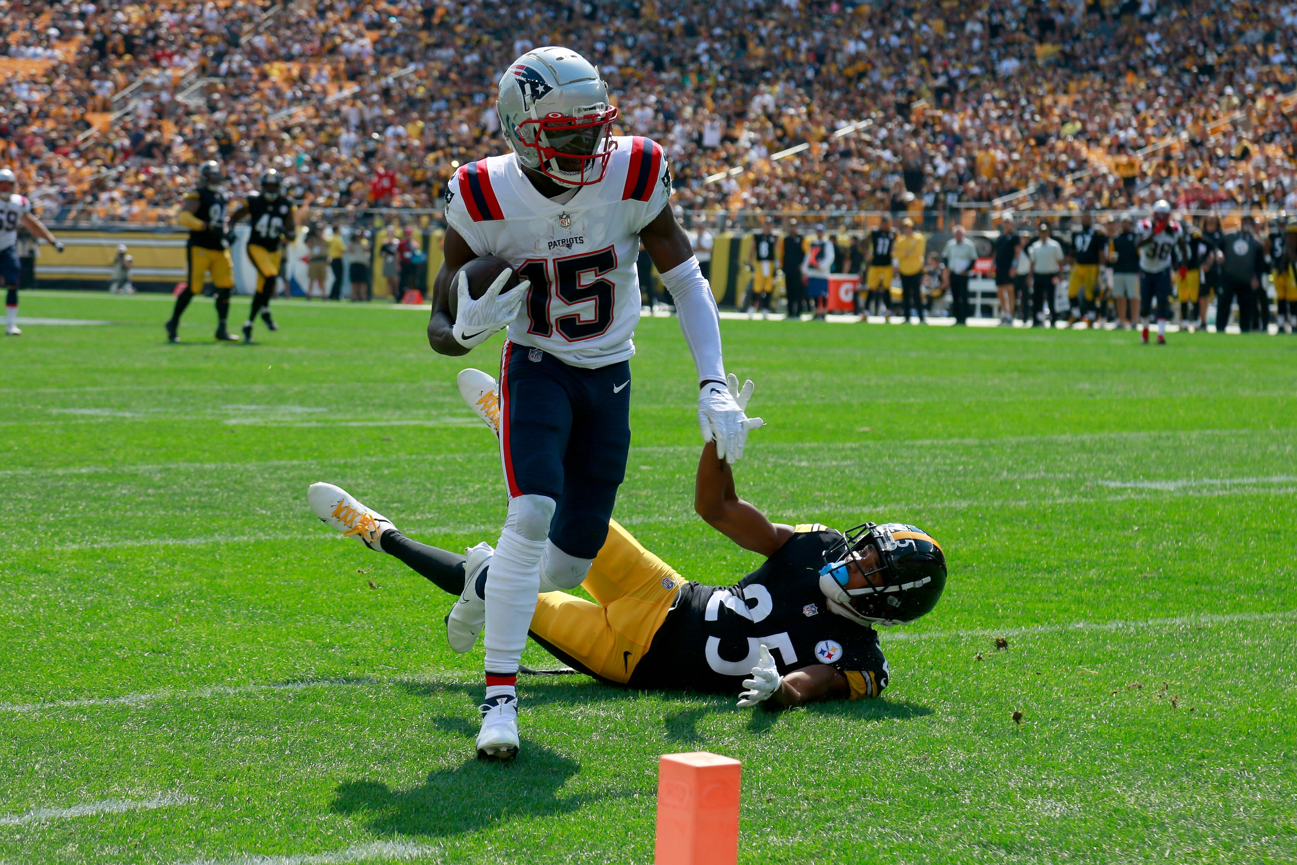 PITTSBURGH, PENNSYLVANIA - SEPTEMBER 18: Nelson Agholor #15 of the New England Patriots scores a touchdown during the first half in the game against the New England Patriots at Acrisure Stadium on September 18, 2022 in Pittsburgh, Pennsylvania.