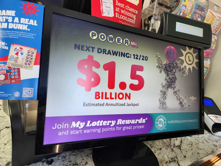 Marylanders buy tickets at Triple Fam Mart in Mount Vernon on Saturday, Dec. 20, 2025, ahead of the $1.5 billion Powerball drawing.