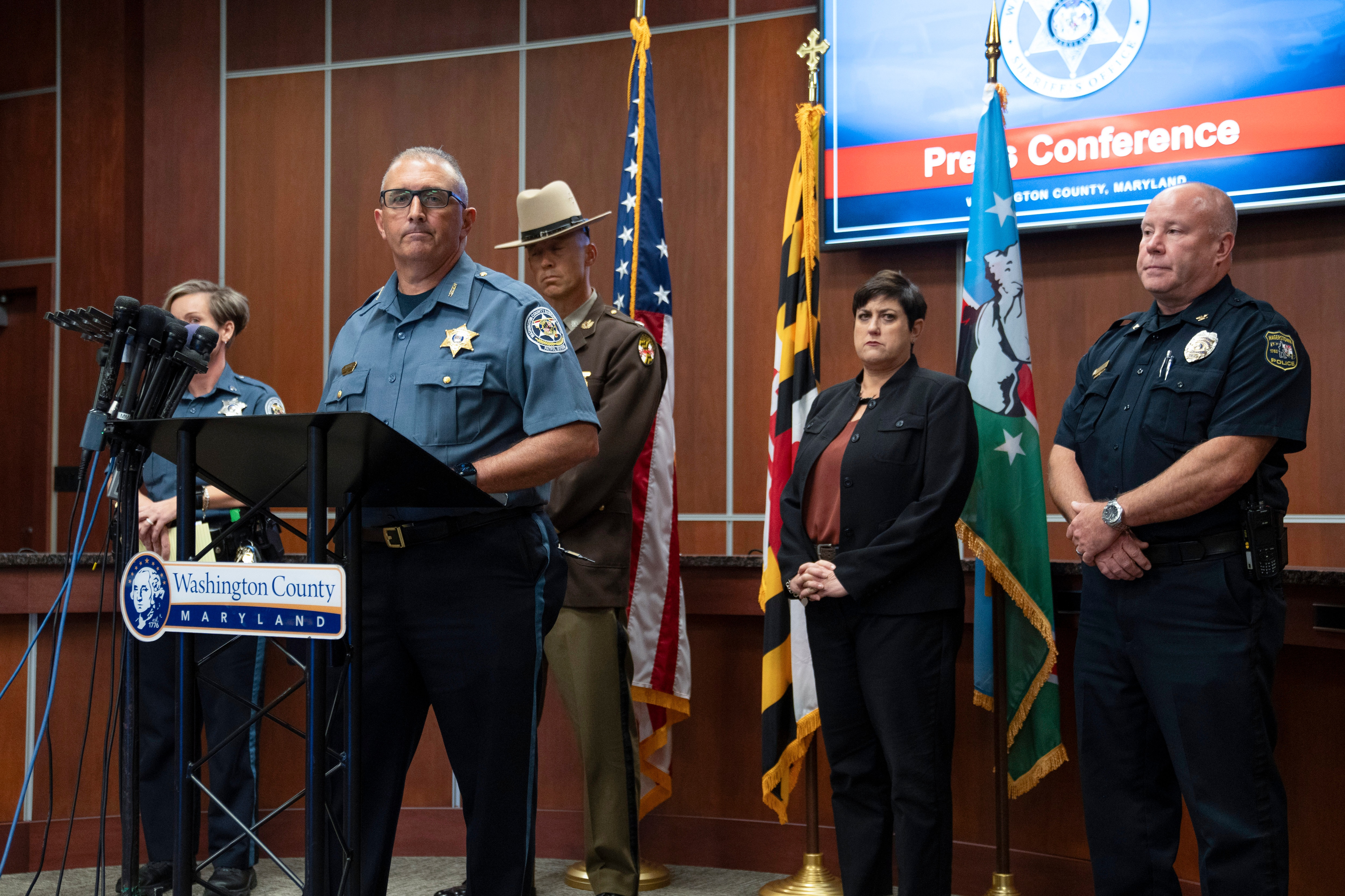 Washington County Sheriff Brian Albert speaks to the media in Hagerstown, Md., about the killing of Maryland circuit court Judge Andrew Wilkinson, Friday, Oct. 20. 2023. Listening from left are Washington County Sheriff Department public information officer Sgt. Carly Hose, Maryland State Police Lt. Col. Dan Pickett, Washington County State's Attorney Gina Cirincion and Hagerstown Police Chief Paul Kifer. (AP Photo/Jon Elswick)