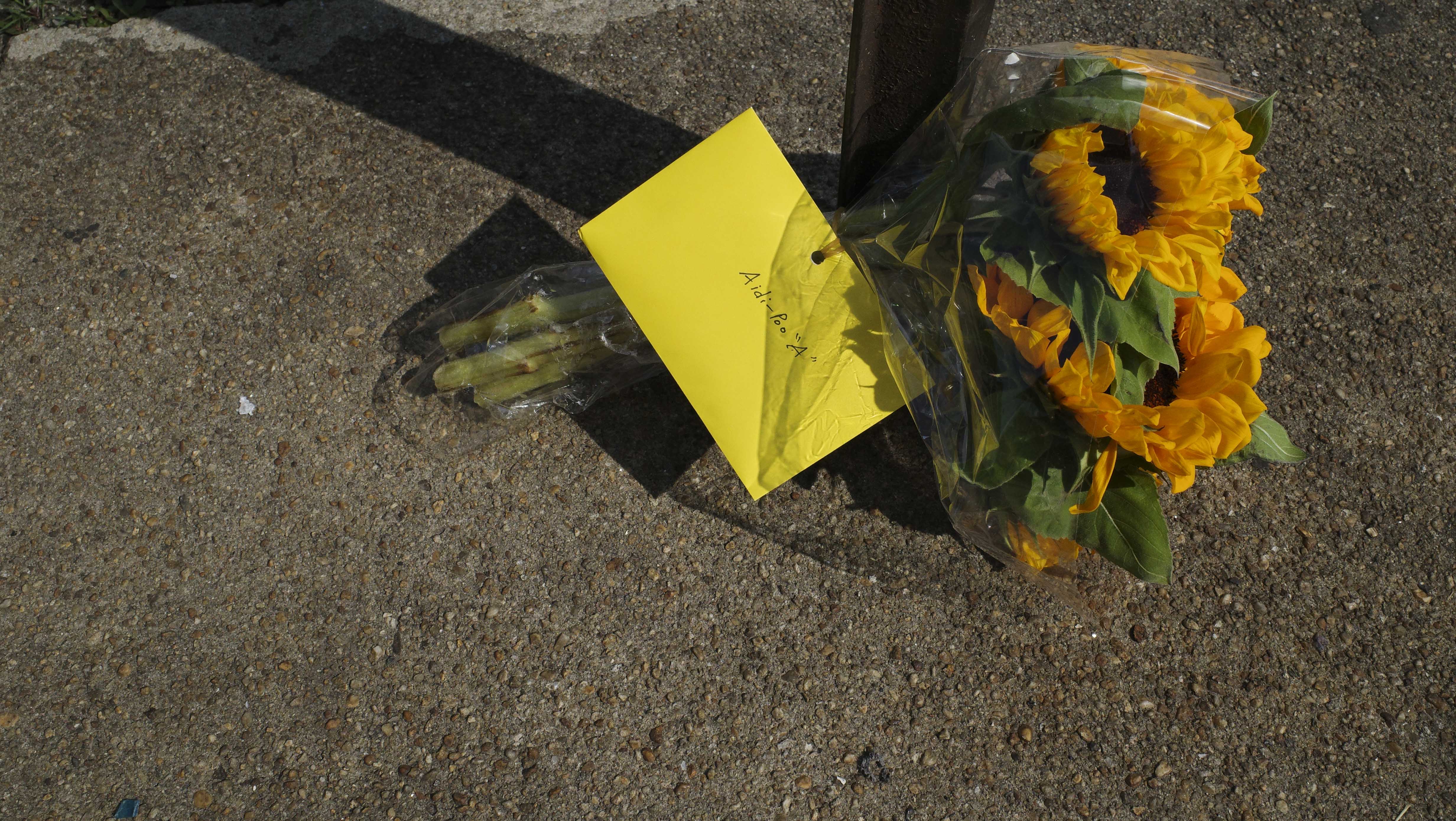 Lisa Filer and Jon Filer left sunflowers and a letter to their son Aidan Filer outside of Starlight Liquors in Baltimore, MD on July 20, 2023. Filer passed away from a fentanyl overdose in this spot while inside of his vehicle three years prior.