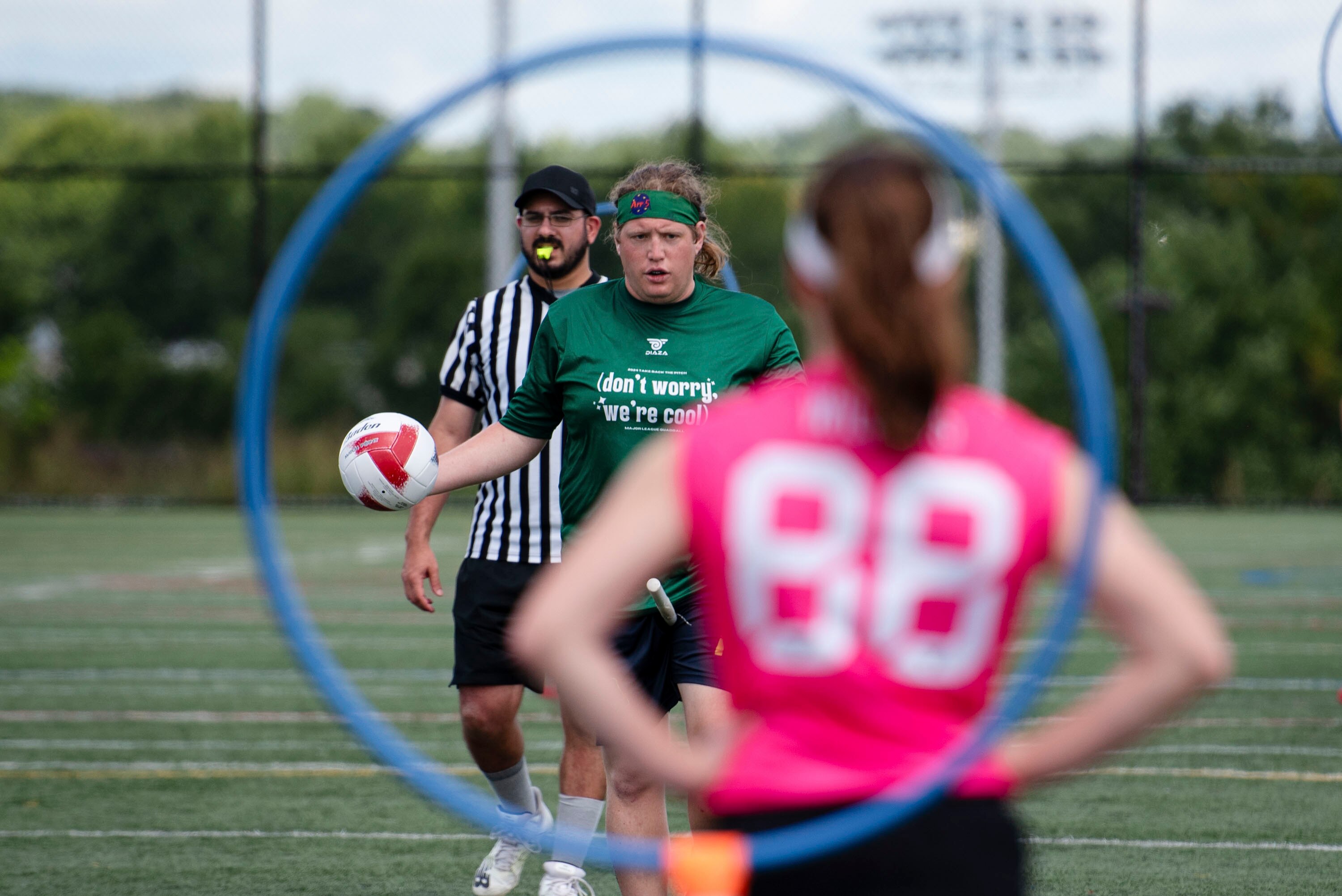A "Don't Worry, We're Cool" team member walks the Quadball downfield during Major League Quadball's "Take Back the Pitch" exhibition matches held on August 19th, 2024 in Howard County, MD.