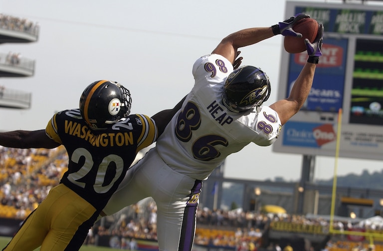 Tight end Todd Heap #86 of the Baltimore Ravens makes a catch as Dewayne Washington #20 of the Pittsburgh Steelers defends on September 7, 2003 at Heinz Field in Pittsburgh, Pennsylvania. The Steelers defeated the Ravens 34-15.