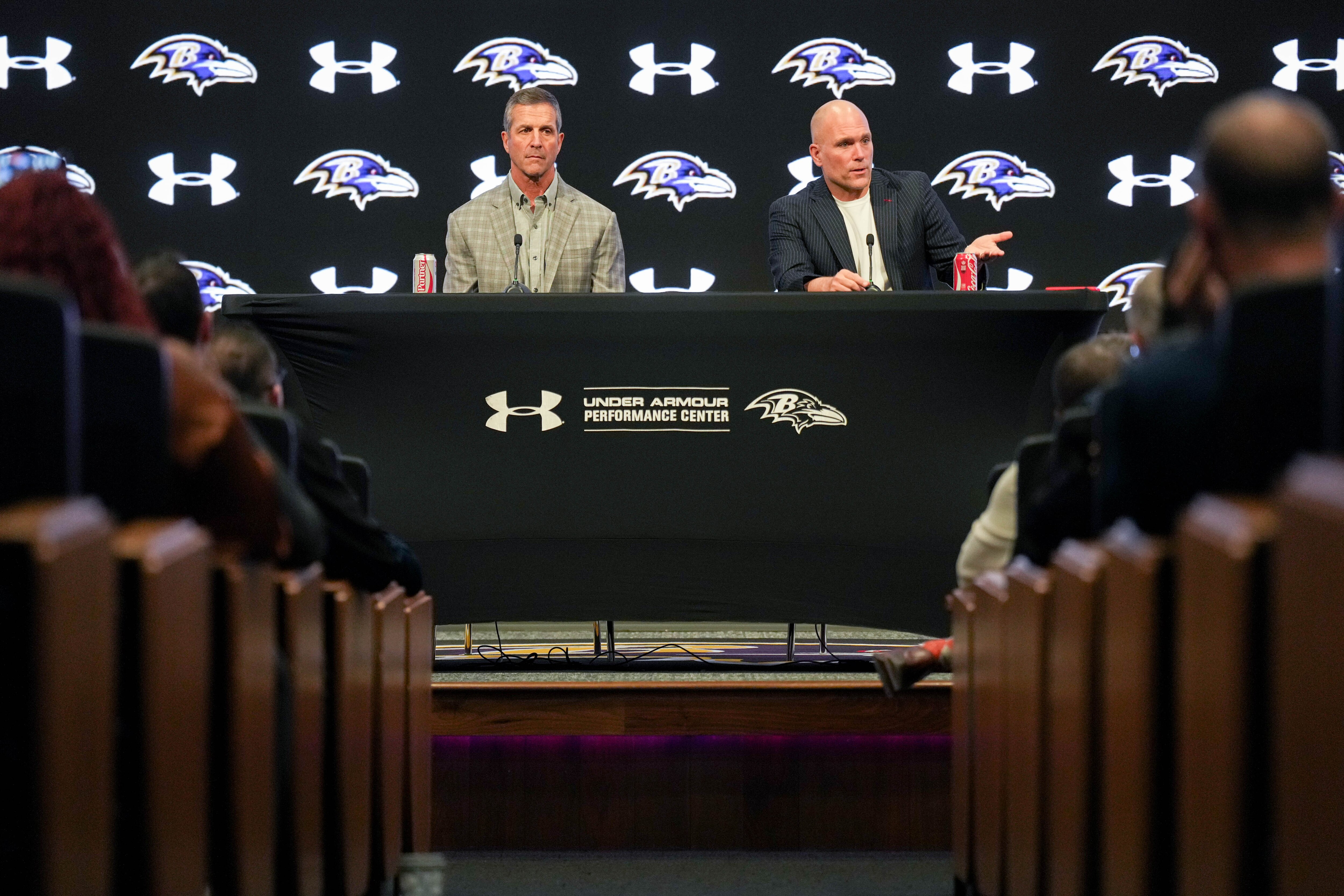 Baltimore Ravens general manager and executive vice president Eric DeCosta, right, and head coach John Harbaugh take questions from reporters at the team’s predraft news conference on Tuesday.