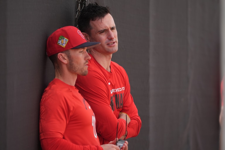 Washington Nationals manager Blake Butera, left, listens to Paul Toboni, the president of baseball operations, during practice on Feb. 12.