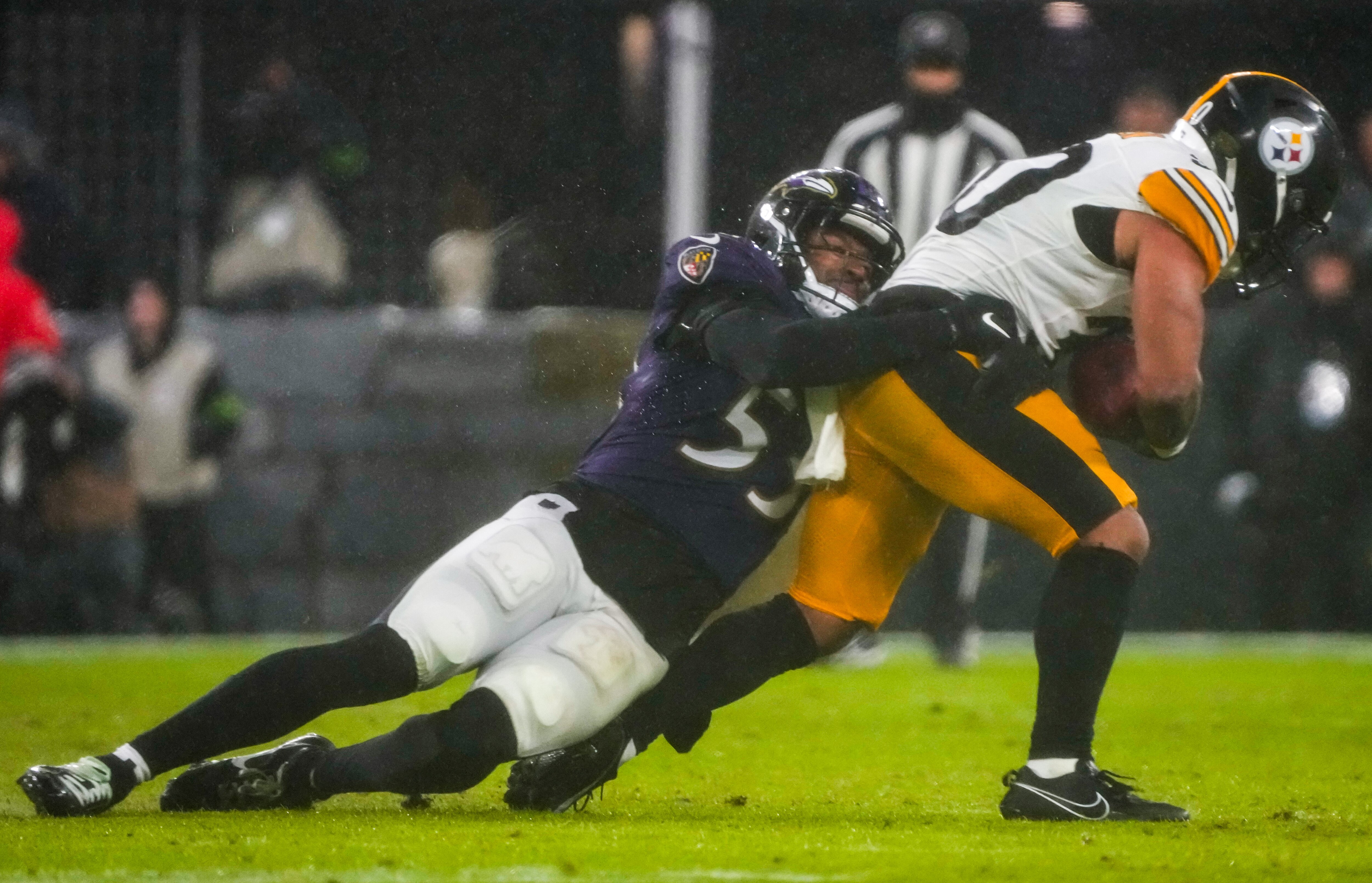 Ravens linebacker Del’Shawn Phillips tackles Pittsburgh Steelers running back Jaylen Warren during the last game of the regular season.
