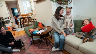 SUNDAY, MAY 24, 2026 - Molly Garcia, 34, husband Neil Gavigan, 36, and their children August Garcia-Gavigan, 4, and Lucy Garcia-Gavigan, 15 months, at their home in Baltimore. August wasn’t offered a spot in a Baltimore City Public School earlier this month, leaving the family to decide whether to wait as late as this summer for another chance or shell out $22,000 for another year of childcare.