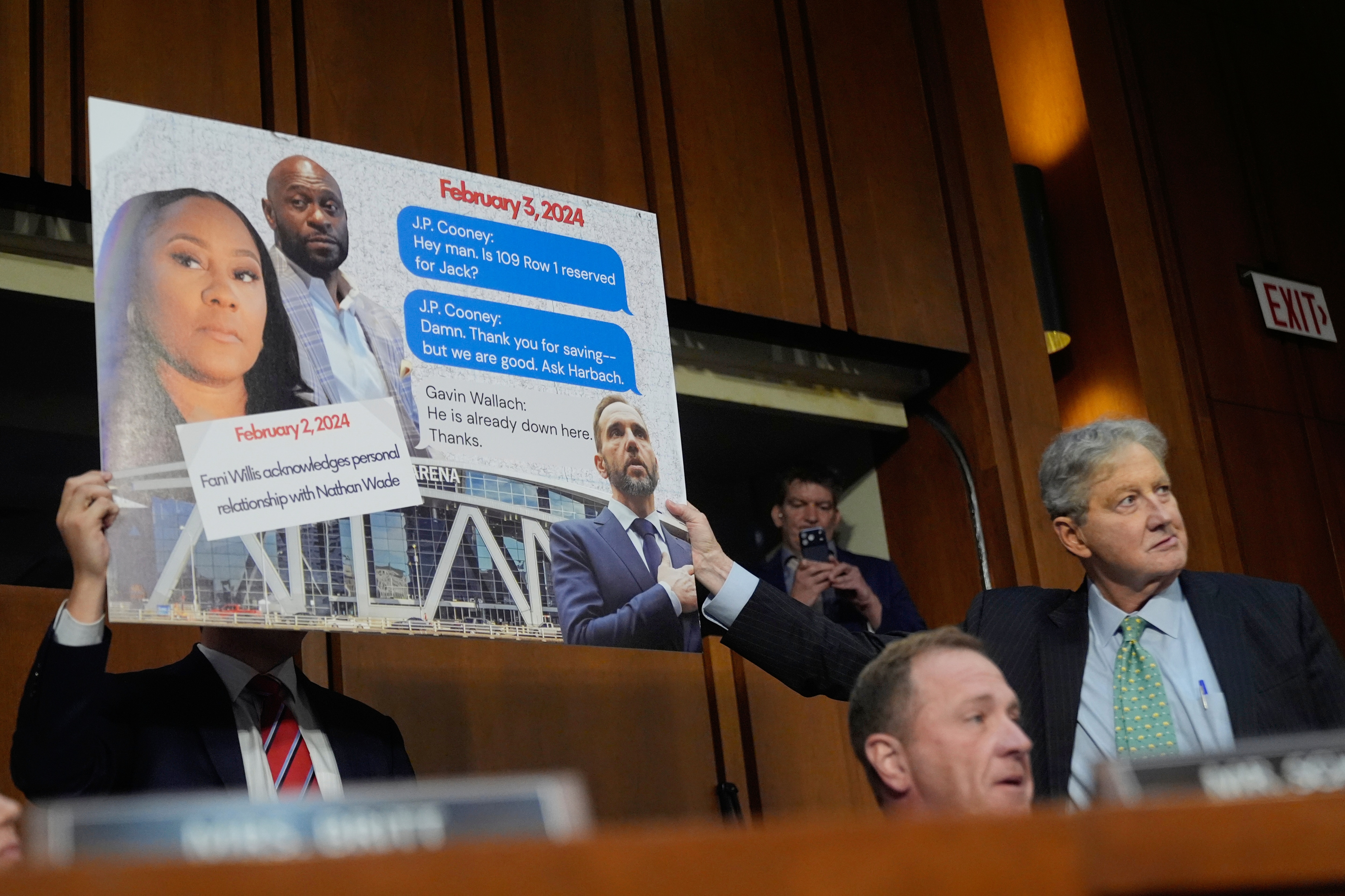 Sen. Eric Schmitt, R-Mo, seated right, with Sen. John Kennedy, R-La., standing right, during a discussion about text messages with former special counsel Jack Smith, as Smith testifies before the Senate Judiciary Committee on Tuesday.