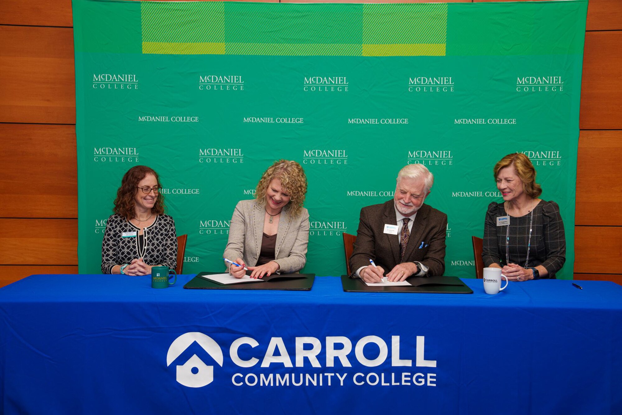 (Left to Right) Dr. Wendy Morris, Acting Provost and Dean of the Faculty at McDaniel, McDaniel College President Dr. Julia Jasken, Carroll Community College President Dr. James D. Ball, and Dr. Rosalie Mince, Provost at Carroll, sign the Memorandum of Understanding on Nov. 16 during a ceremony held at Carroll.