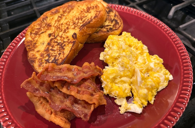 All the ingredients you’ll need to make the Karen Special at home: bacon, eggs, milk, butter, challah bread, vanilla extract, cinnamon and maple syrup.