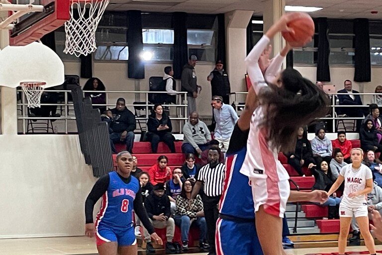 Mercy's Myah Hazelton shoots over Old Mill's Amani Watts in Tuesday night's 57-52 Mercy win. Hazelton, a 6-4 center/forward, finished with 27 points to lead the No. 7 Magic to victory over the No. 8 Patriots. Hazelton, a transfer from Sparrows Point, hit 11 of 14 shots including two 3-pointers.