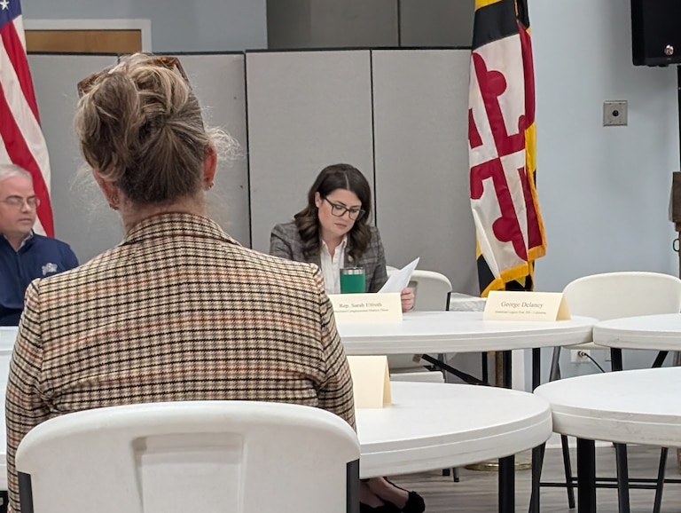 U.S. Rep. Sarah Elfreth takes notes during a veterans roundtable in Crownsville on Nov. 3, 2025.