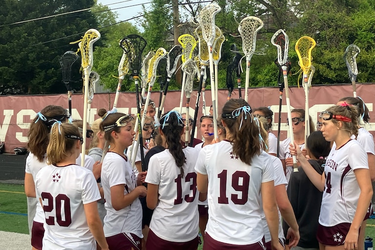 Sticks up, the Towson girls lacrosse team stands alone atop Baltimore County after defeating rival Hereford, 14-8, on Wednesday.