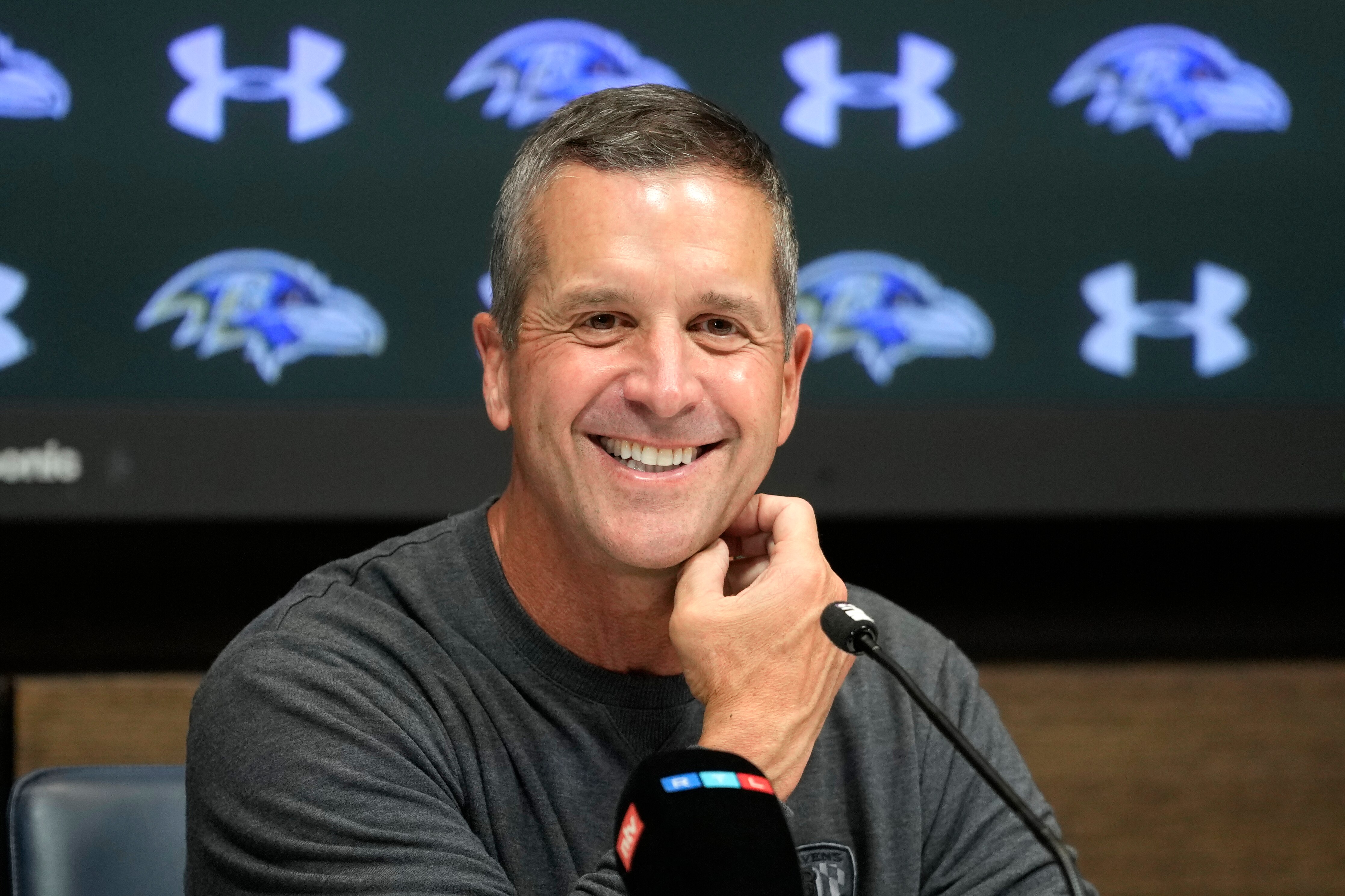 Ravens coach John Harbaugh is seeking a second Super Bowl title. He won the first coaching against his brother.