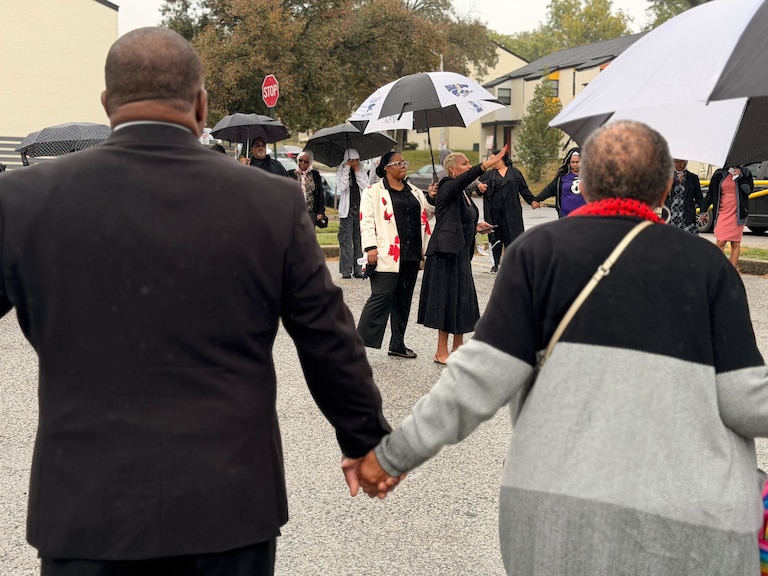 Community members gathered at the Leon Day Park Sunday morning to hold a prayer circle for a 12-year-old girl killed in a shooting there during a homecoming football game on Oct. 3 after two men got into a dispute over parking.
