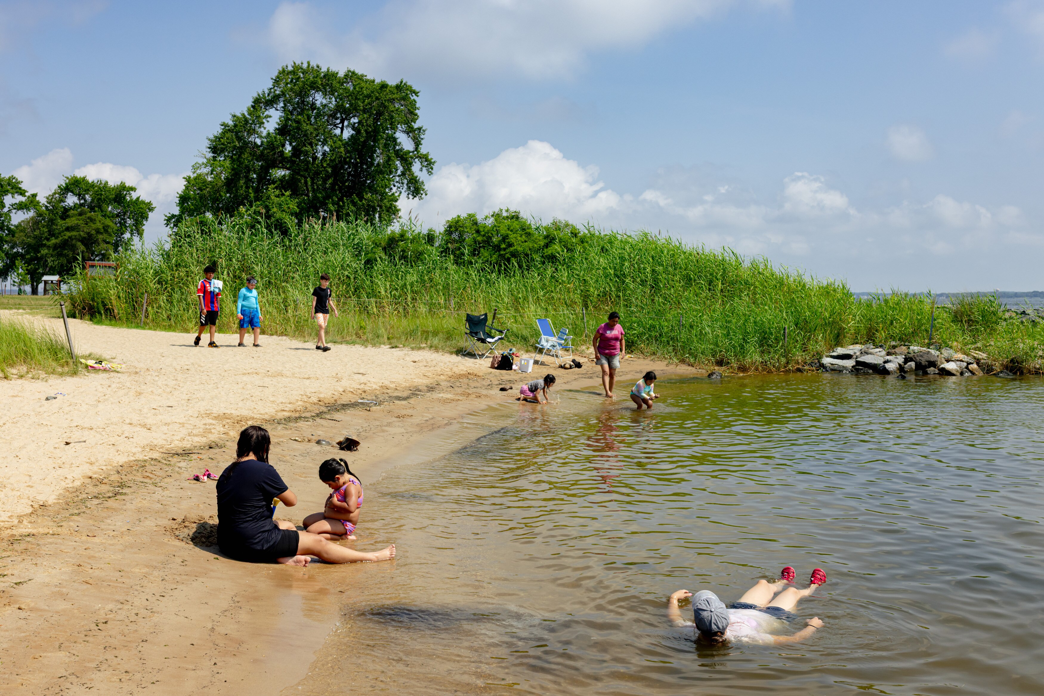Beachgoers enjoy the waterfront at Fort Smallwood Park in Pasadena.