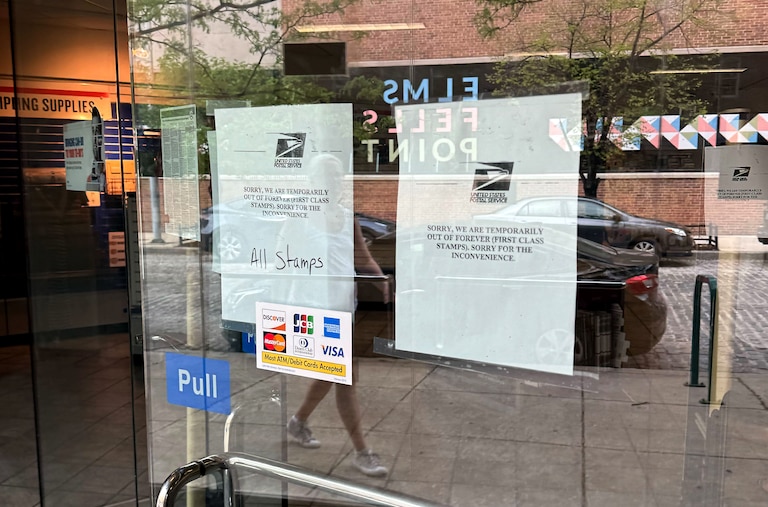 Signs on the door of the United States Postal Office in Fells Point at 714 S Wolfe Street in Baltimore note a lack of Forever stamps at the location.
