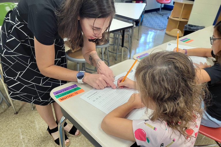AUGUST 28, 2026 - Brittany Ferrari demonstrating cursive writing to Annie Sager who is 6 and a rising first grader.
