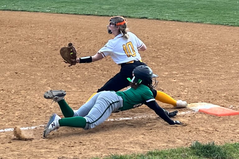 Arundel's Bria Sewell dives for first base as Northeast first basemen Mackenzie Weiland has the ball for the out during the third inning of Monday's Anne Arundel County softball contest. The Eagles improved to 11-1 with a 4-1 victory in Pasadena.