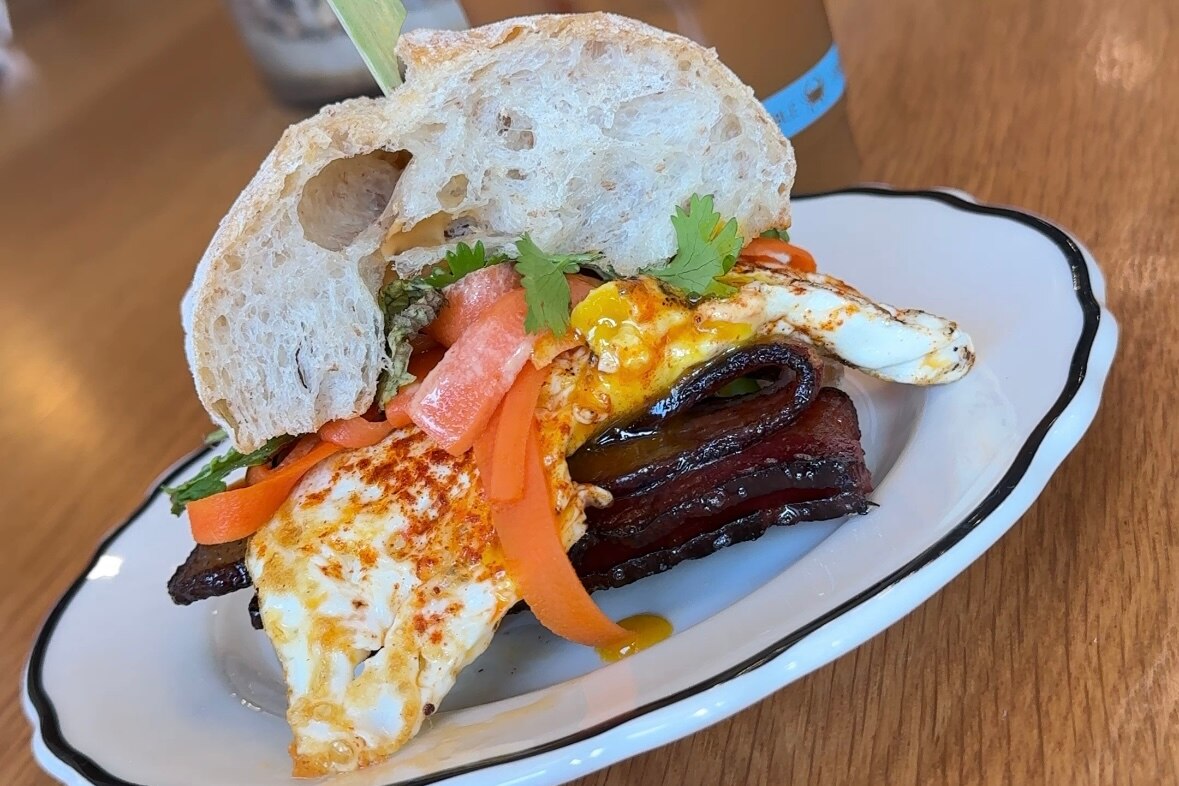 “What The Kitchen Eats” at Catalog Coffee includes a paprika fried egg, turkey sausage and a spicy cito sauce.