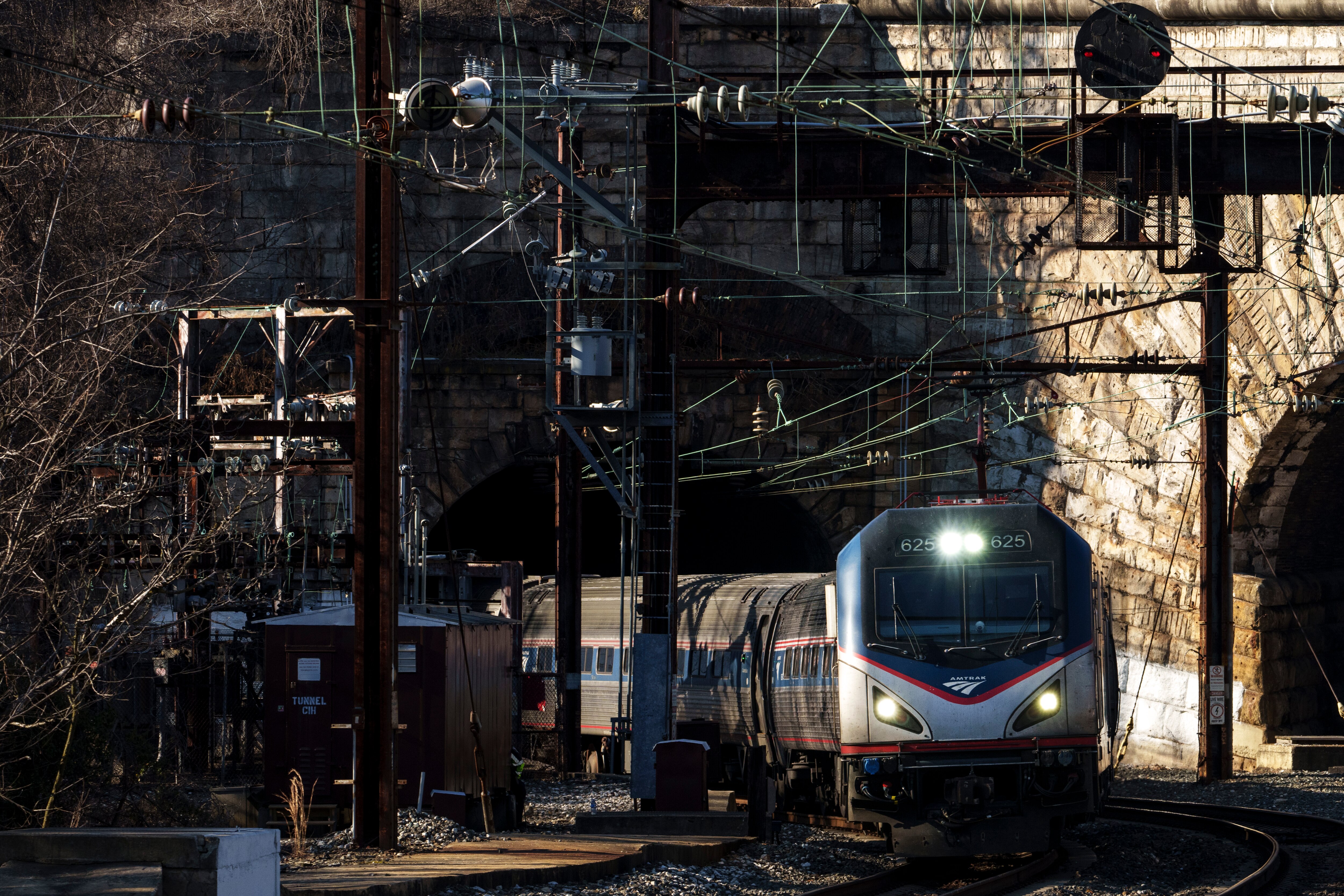 BALTIMORE, MARYLAND - JANUARY 30: An Amtrak train moves through the Baltimore and Potomac (B&P) Tunnel before an event featuring U.S. President Joe Biden at the site on January 30, 2023 in Baltimore, Maryland. The tunnel is 150 years old and is the biggest chokepoint in the rail system between New York City and Washington, DC and frequently causes delays of Amtrak, Maryland commuter trains and freight rail traffic. Biden is discussing how funding from the recently passed Infrastructure Investment and Jobs Act will aim to rebuild and replace the tunnel.