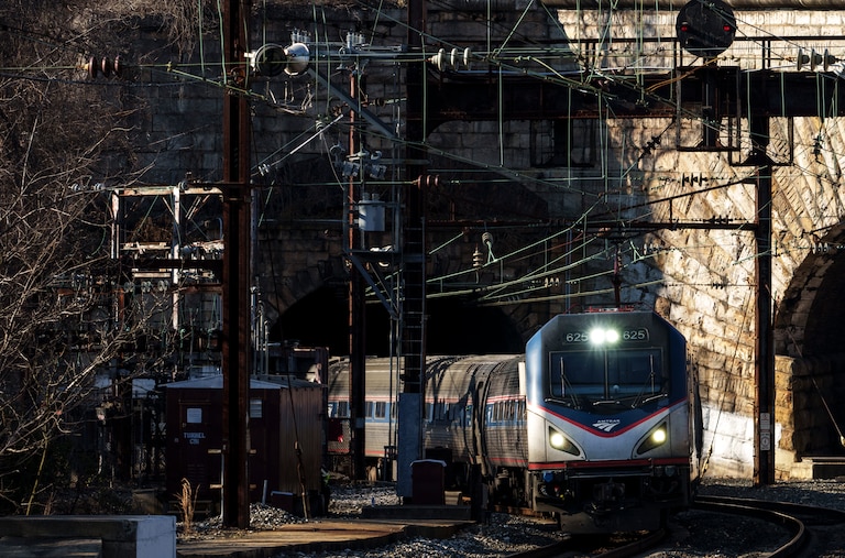 BALTIMORE, MARYLAND - JANUARY 30: An Amtrak train moves through the Baltimore and Potomac (B&P) Tunnel before an event featuring U.S. President Joe Biden at the site on January 30, 2023 in Baltimore, Maryland. The tunnel is 150 years old and is the biggest chokepoint in the rail system between New York City and Washington, DC and frequently causes delays of Amtrak, Maryland commuter trains and freight rail traffic. Biden is discussing how funding from the recently passed Infrastructure Investment and Jobs Act will aim to rebuild and replace the tunnel.