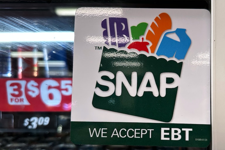 FILE - SNAP EBT information sign is displayed at a gas station in Riverwoods, Ill., Saturday, Nov. 1, 2025. (AP Photo/Nam Y. Huh, file)