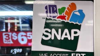 FILE - SNAP EBT information sign is displayed at a gas station in Riverwoods, Ill., Saturday, Nov. 1, 2025. (AP Photo/Nam Y. Huh, file)
