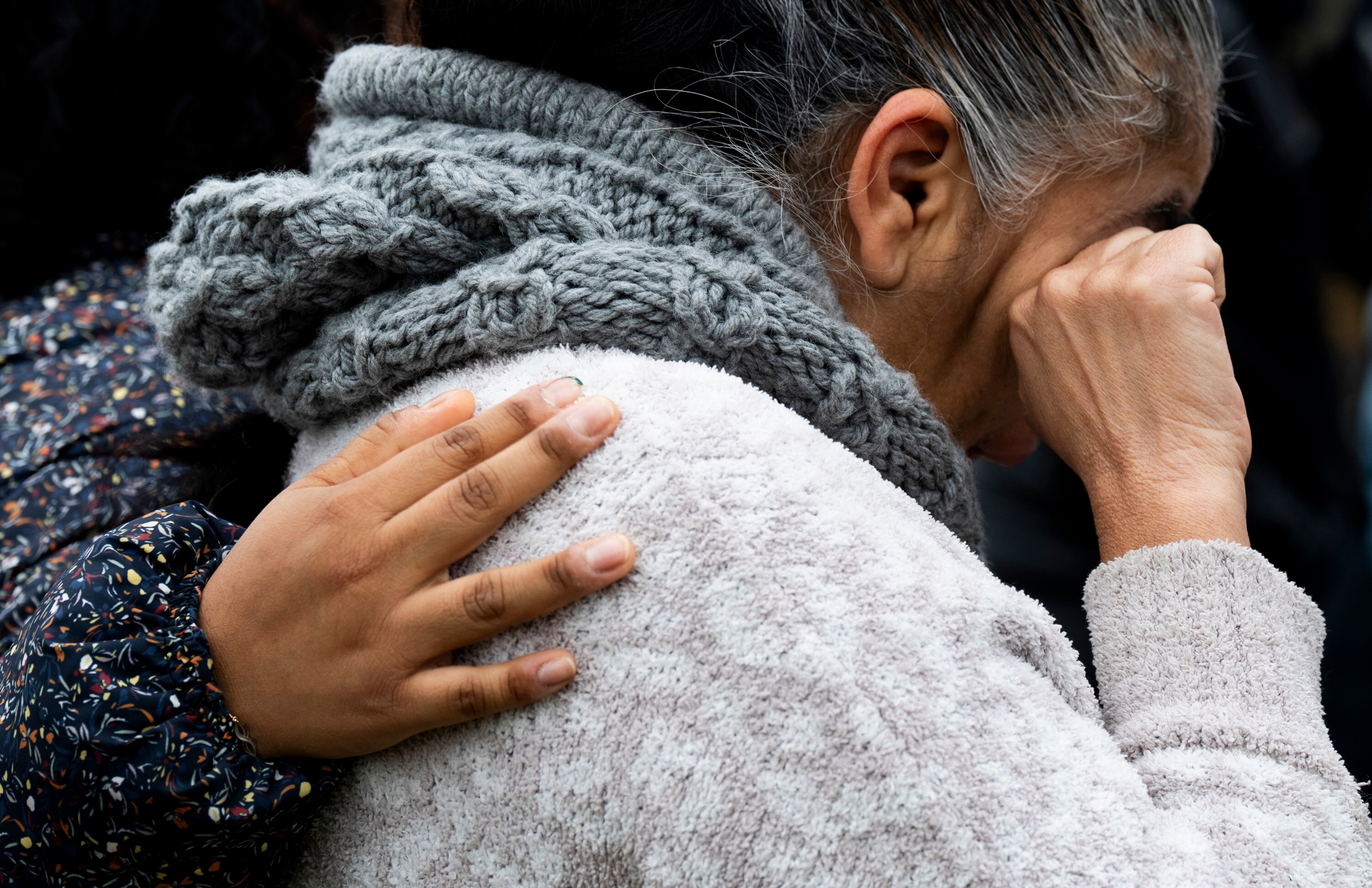 Community members participated in a prayer circle held in front of the Patterson Park Observatory despite the rainy morning on March 28, 2024. Redemption City Church guided the community in prayer and hymns.