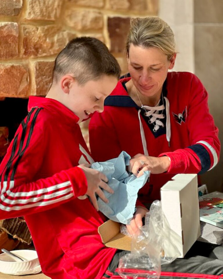 Samantha Reigel Green opens presents with her son, Liam Reigel, in 2023.