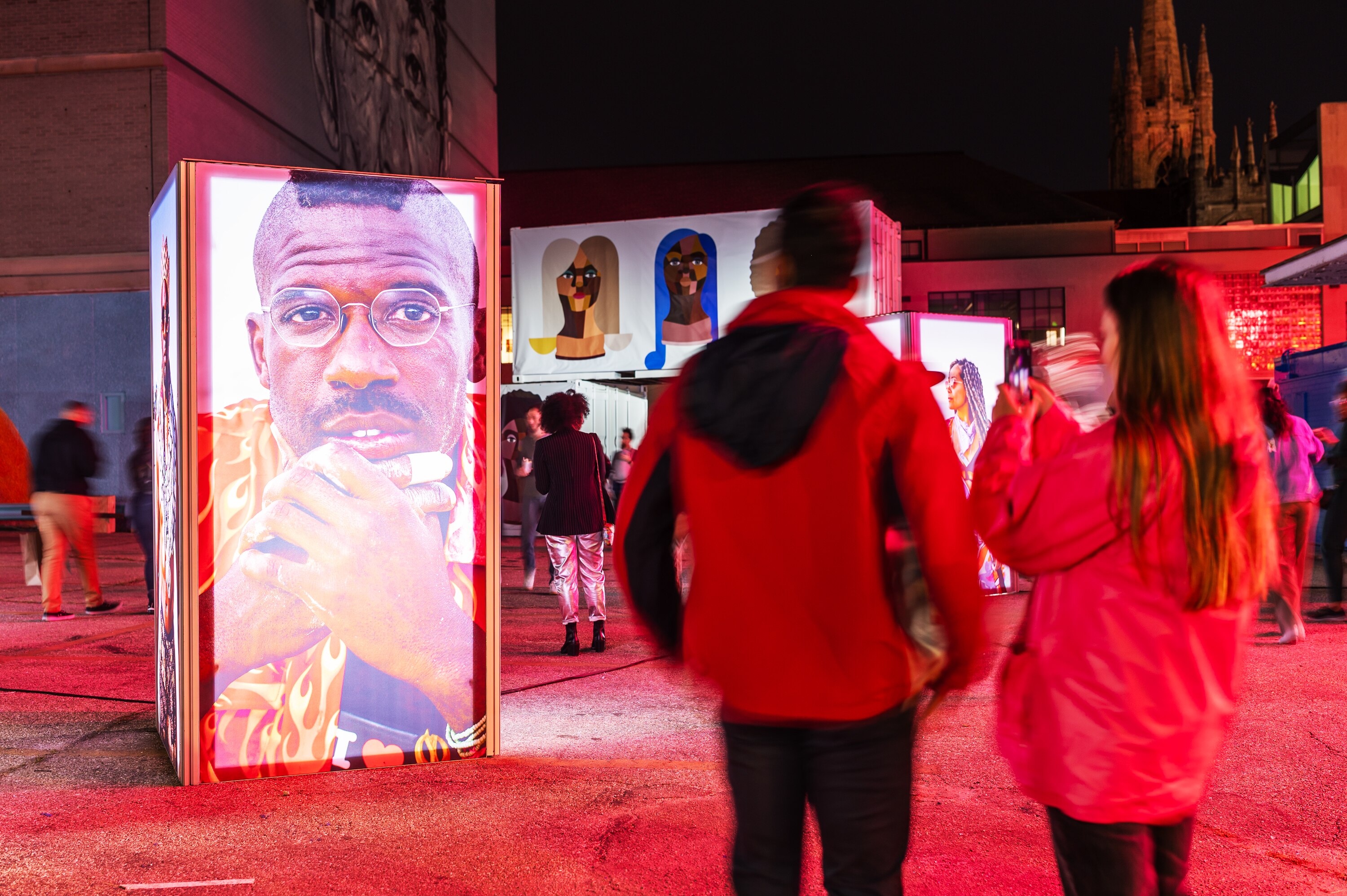 Attendees visit the Black Burner Project exhibit by Erin Douglas at Artscape.
