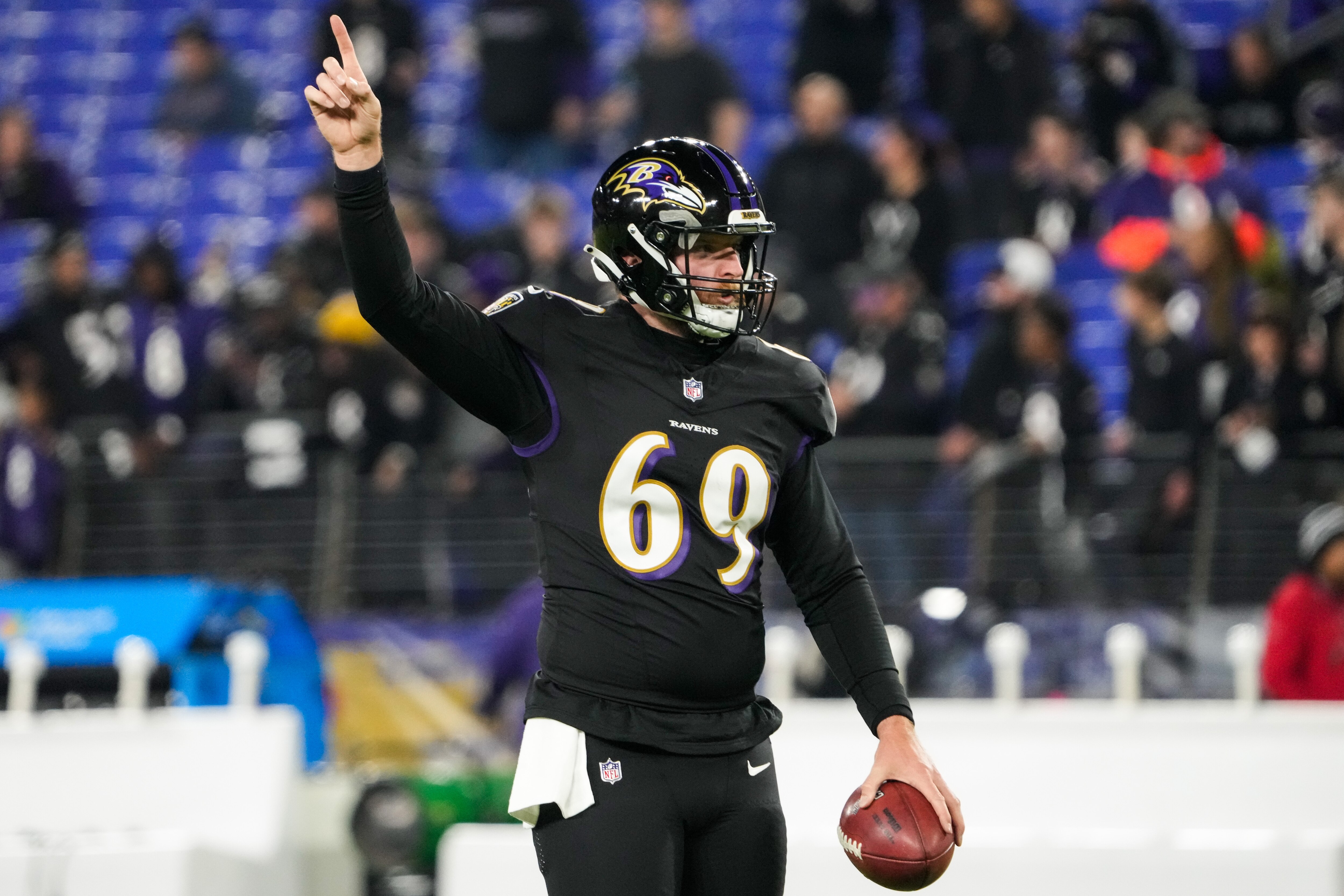 Ravens long snapper Tyler Ott warms up before the game against the Bengals on Thursday night.