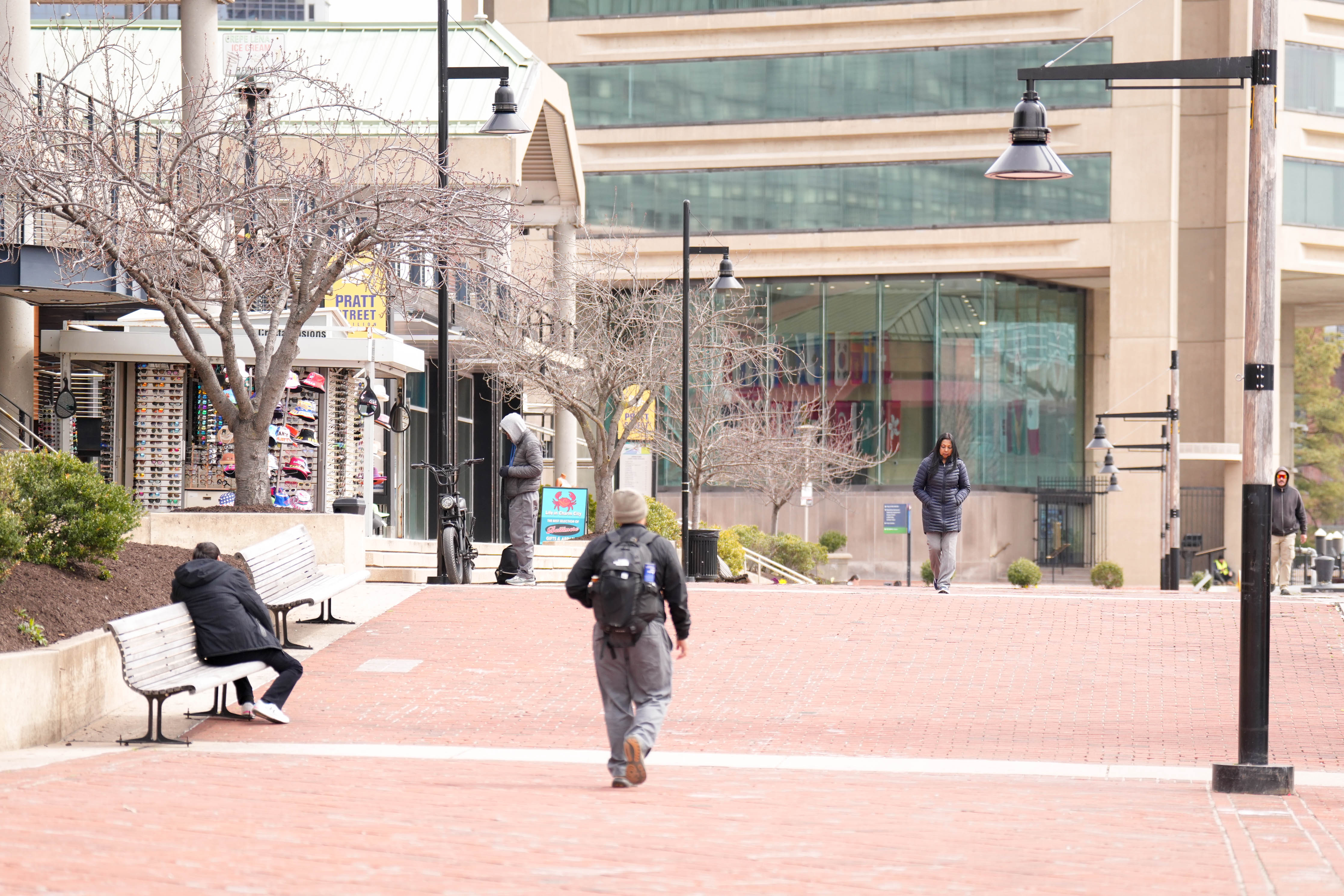Pedestrians meander through Harborplace at lunchtime.