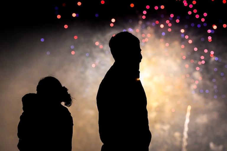 People on Pier 4 watch as fireworks go off in the Inner Harbor as Baltimore City celebrates Independence Day on July 4, 2023.