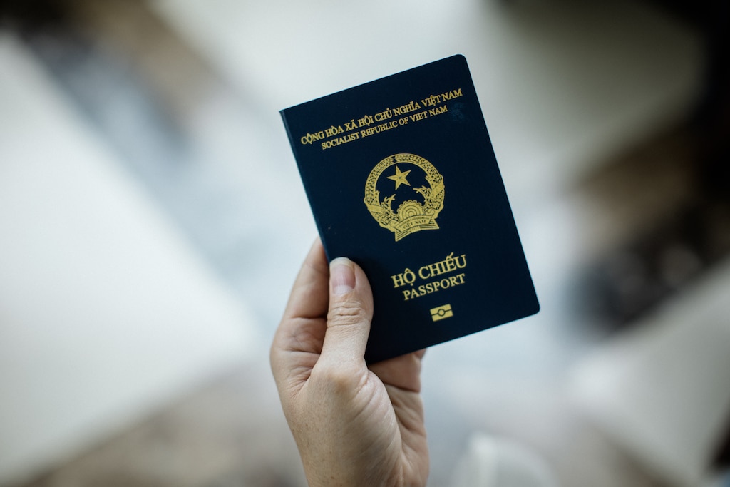 Dong Nai, Vietnam - July 26, 2026: Melissa Tran, 44, holds her Vietnamese passport on July 26, 2026. This is the first time that she has owned a passport. Rosem Morton for The Baltimore Banner