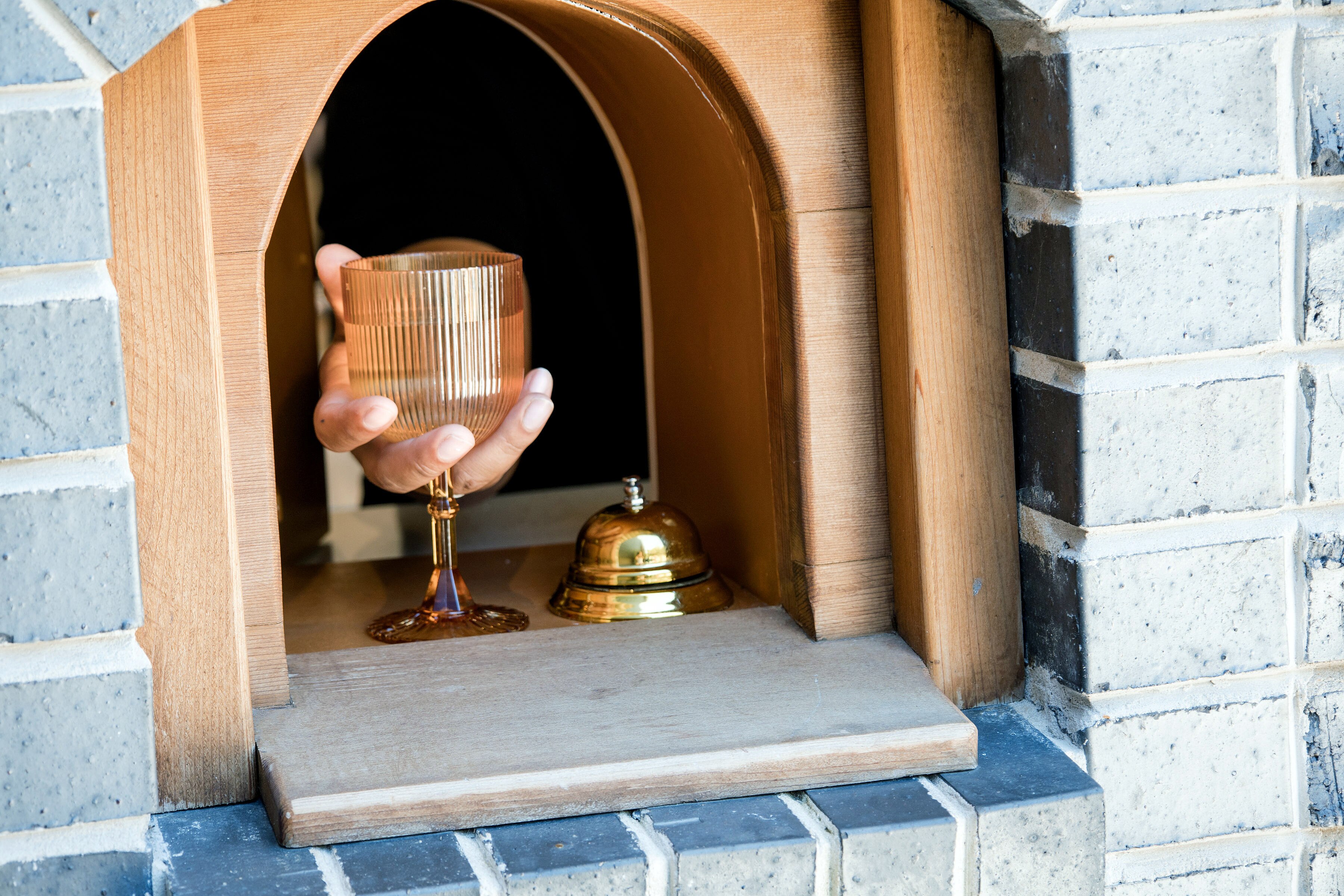 Kneads Bakeshop & Café has its own wine window, where you can take a glass with you while shopping around Cross Keys.