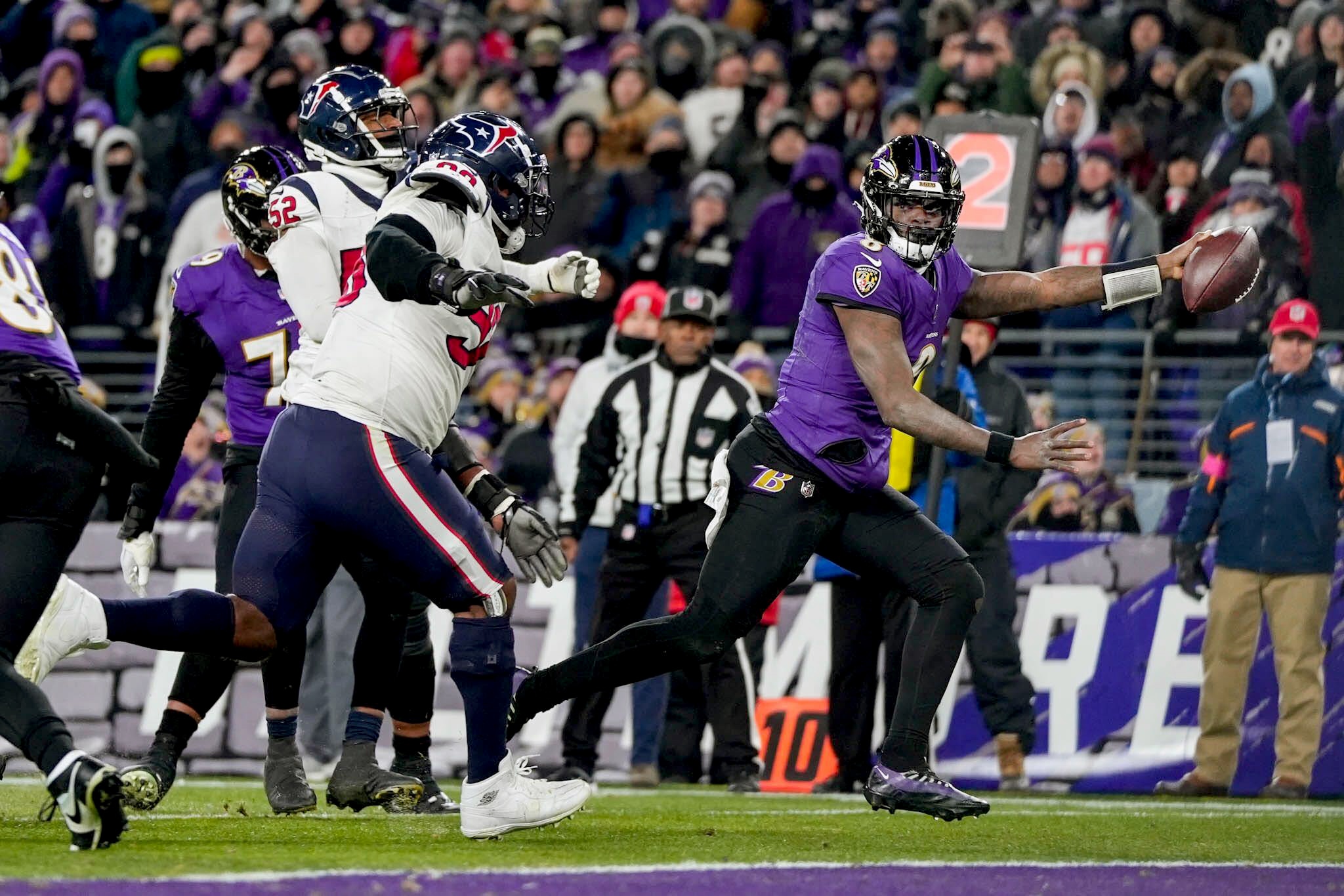Ravens quarterback Lamar Jackson scores his second rushing touchdown during Saturday's 34-10 win over the Houston Texans on Saturday.