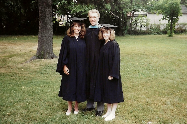 Fred Cogwell in 1991 with his daughters Kim and Julie on their graduation day from UMBC, the same day Fred participated in the Owings Mills High School graduation as principle. He ran from one graduation to the next.