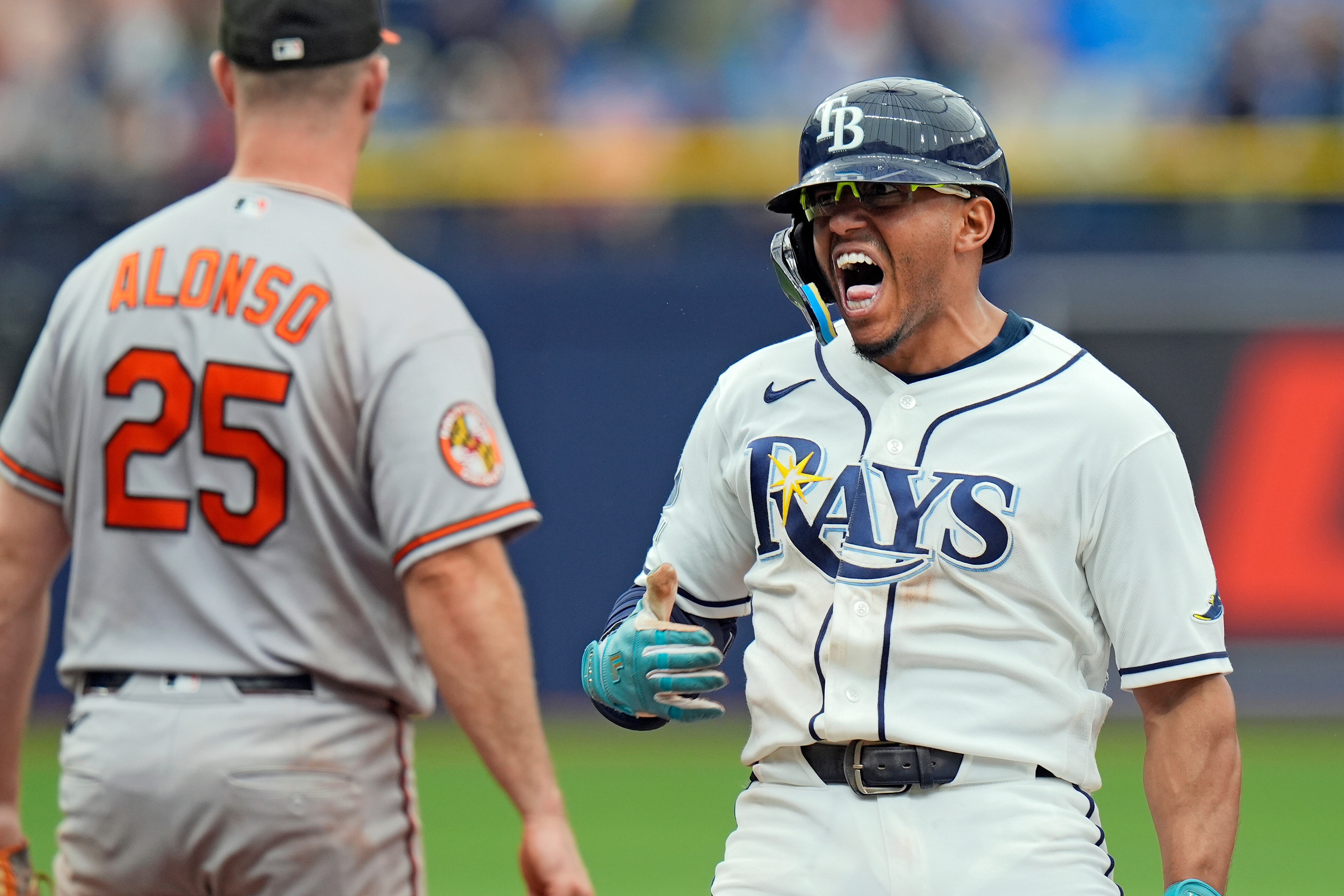 Tampa Bay Rays' Richie Palacios, right, celebrates near Orioles first baseman Pete Alonso after his RBI single off pitcher Rico Garcia during the eighth inning.