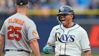 Tampa Bay Rays' Richie Palacios, right, celebrates near Orioles first baseman Pete Alonso after his RBI single off pitcher Rico Garcia during the eighth inning.