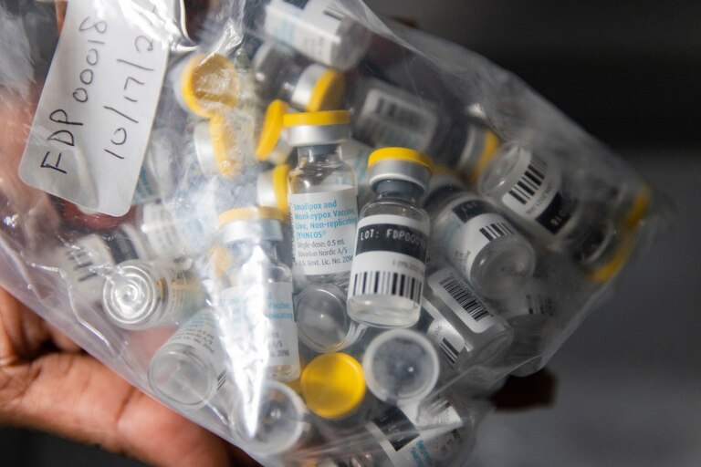 Vials of single doses of the Jynneos vaccine for monkeypox are seen from a cooler at a vaccinations site.