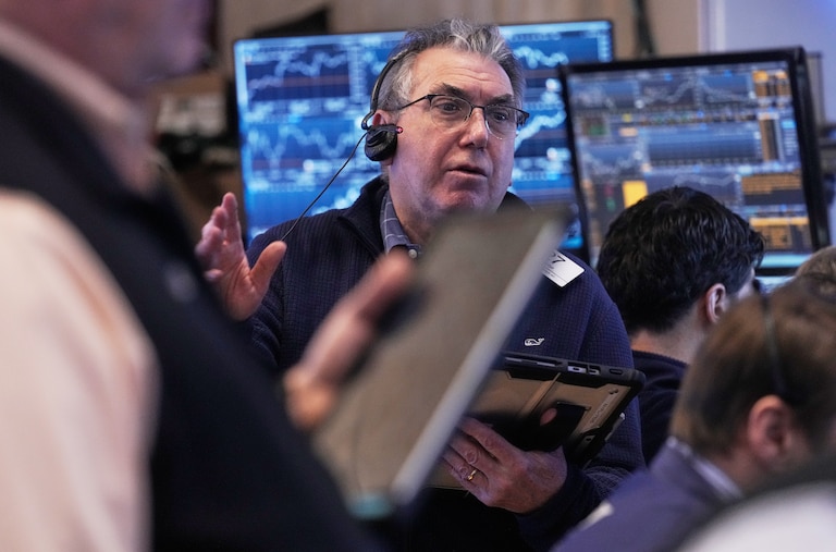 A trader works on the floor of the New York Stock Exchange