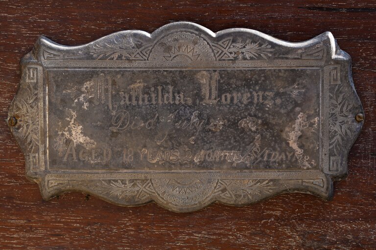The nameplate on Mathilda Lorenz’s empty casket on July 28, 2022. The mysterious casket was originally found down by a stream in Wyman Park.