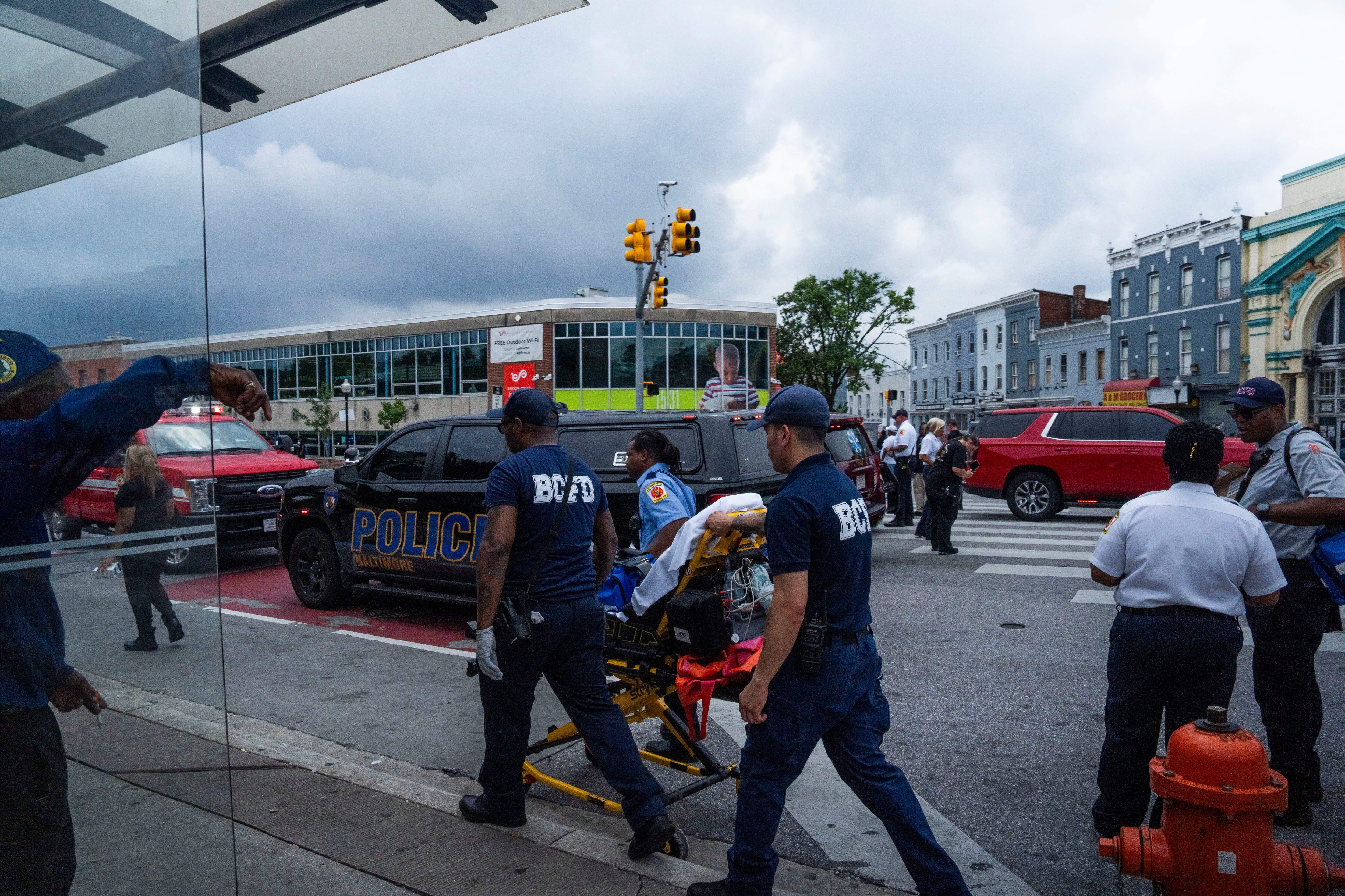 First responders, the mayor's office and community members gather at the intersection of Pennsylvania and North Avenues on July 10, 2025 after an alleged mass overdose took place in the area.